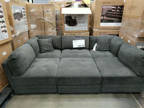 It comes with two armless chairs, three corner chairs, and one ottoman. . Costco modular sectional